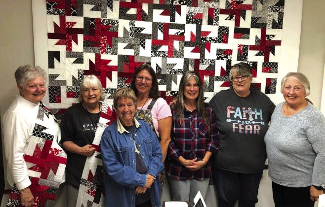 Day one at Cherry Spring Quilt Retreat. The quilt behind us is the Crazy 8 quilt pattern. Pictured front and center, Sue Ransom (Richland Springs, TX). Back row (L-R) Terry Seyler (Center Point, TX), Debbie Phelan (Richland Springs, TX), Toni Hill (Brownwood, TX), Lynda DeGroot (Richland Springs, TX), Kathy Davee (Richland Springs, TX) and Cheri Horning (Center Point, TX) Photo Courtesy of Debbie Phelan
