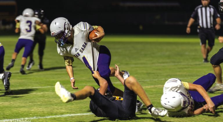 8th grader #4 Rextyn Hunt stays on his feet despite a low tackle attempt by Goldthwaite.