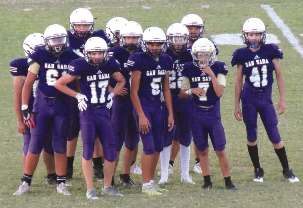 Battle of the River - JH Edition - 7th and 8th grade SSJH Football vs Goldthwaite: 8th Dillo offense awaiting the play call from Coaches Submitted by Chino Z.