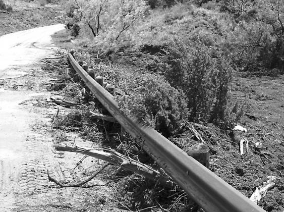 “The photo shows where water running off an adjacent farm was carrying dirt and debris onto and across the highway.”