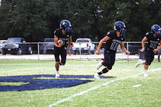 Just see the teamwork of #8 Troy Shelton, #17 Billy Perry, and #11 Kenny Triplett in Friday night’s blowout against High Island Cardinals. Photo by Raegan Wright