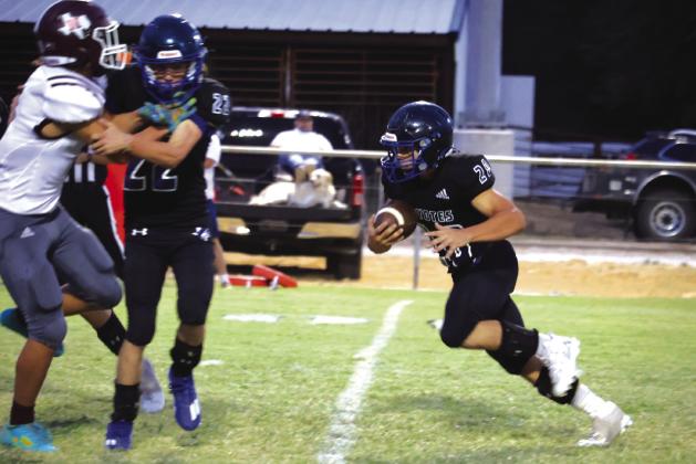Coyote #20 Gage Behrens finding a clear path through the enemy lines in last Friday night’s win against High Island Cardinals. Photos by Raegan Wright