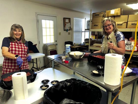 Frankie and Laura are cooking up ground beef.