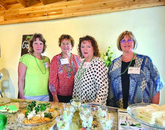 March hostesses l-r Jacqueline Carlson (chair), Debbie Shahan, Abby Snyder, and Janis Murray