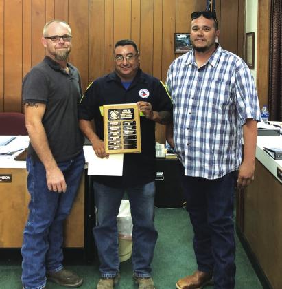 Ramiro Martinez, Sanitation Department employee, received the Employee of the Month award for September 2022. Pictured from left to right: Alderman Michael Nelson, Ramiro Martinez, and Juan Montoya, Supervisor of the Sanitation Department. Photo by Scott Glaze