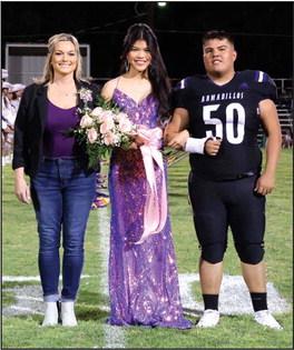 Senior Nominee One Nguyen, daughter of Long and Thu Nguyen, escorted by her teacher, Mrs. Deeds. Flower presenter: Jancsi Cuevas, son of Ivan and Rosaura Cuevas.