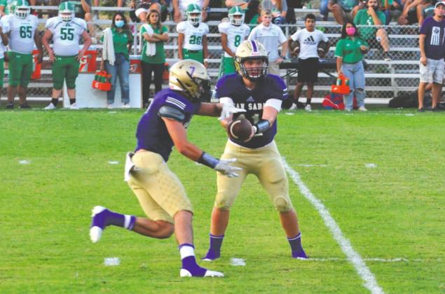 Senior QB #11 - Risien Shahan hands off to Senior #7 Stone Sears.