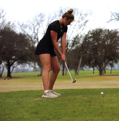 Josie Oliver takes a practice swing at the 1st Annual Ronnie Schulze Golf Tournament