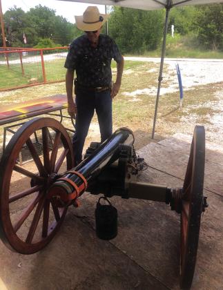 SCV member, Ross J. Cox, Sr., examines a ½ scale cannon near Brownwood as the Saltworks Camp plans to acquire a full-scale model. Photo by Michael Oliver
