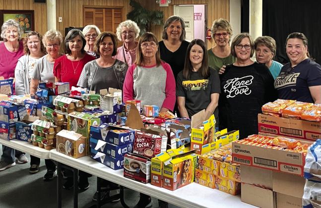 “Grub Bags” stuffing volunteers left to right: Jeanne Owens, Abby Snyder, Mikie Bishop, Frances Hibler, LoyNell Behrens, Pam Wallace, Trish Warren, Holly Wise, Joanne Weik, Corina Fauley, Tracey Thomas, Janis Murray, Michele Whitley and Amy Foster. Not pictured: Scott Snyder and Mike Thomas.