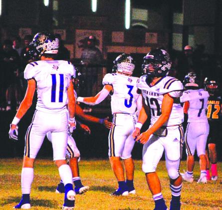 Levi Glover (11), Winton Lackey (12), Lance Taylor (3), and Haiden Van Bibber (7) get ready on defense.