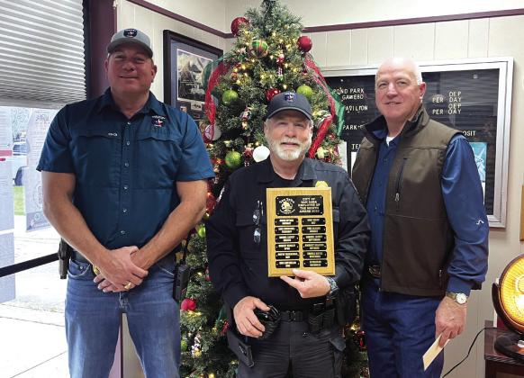 Police Chief John Bauer, Sergeant Charlie Boyce (Employee of the Month for November), and City Manager Scott Edmonson