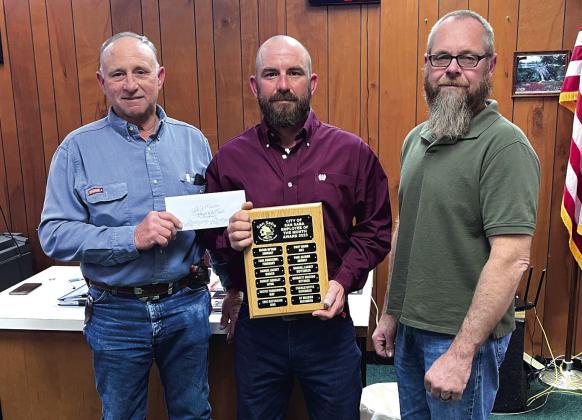 Electric Department Supervisor Denver Daniel, Electric Department Lead Man GT Meador (Employee of the Month for December), and Alderman Michael Nelson
