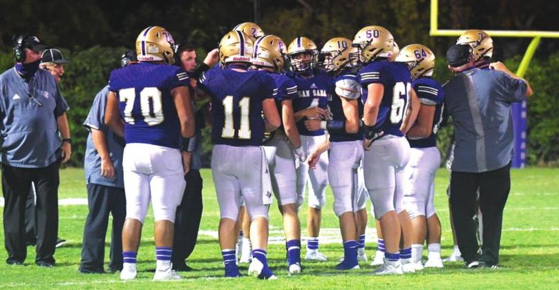 The San Saba High School varsity football team gathers together during a timeout on September 4, 2020, while playing a non-district home game vs. Rogers High School. (Photo courtesy of Rita Boultinghouse)