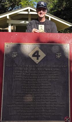 Andrew Bass, author and cousin of Chauncy White, standing in front of a memorial at the Fourth Marine Division Camp in Maui, HI.