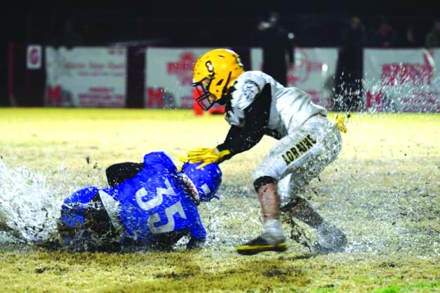 Joey Bond fighting through the tough conditions at the state quarterfinals game against the Loraine Bulldogs last Friday night. Photo courtesy of Rita Boultinghouse