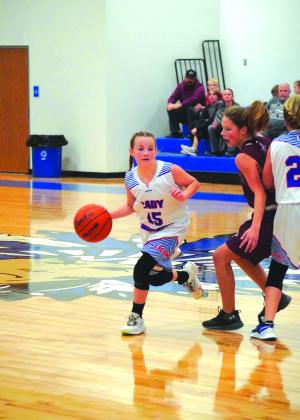 Preslee Duggan pushing the ball in the JH girls basketball game last week against Zephyr. Photo courtesy of Valerie Valdez