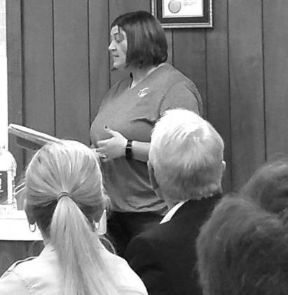 Briana Woolsey giving her presentation to the Commissioners Court and to the City Council.