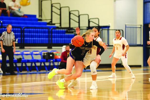 Freshman #1 Sydni Jones drives the ball past opponent in Monday night’s 70-19 win. Jones also lead the team with 28 points for then evening.