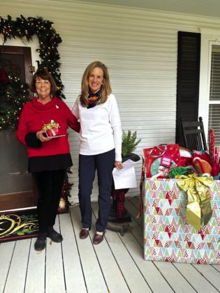 Cissy Williams and Ann Wilson welcome Pierian members to the club's Christmas Guest Tea which was held on Thursday, December 14th, at the home of Rhonda Killion. Each member brought a gift for Angels Unaware of San Saba County.