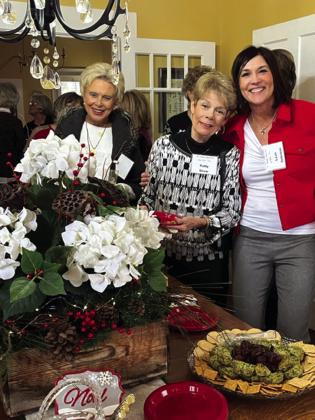 Cydney Pearce, Patty Shaw, and Leah Oehrlein enjoy visiting in Rhonda Killion's festively decorated home. Members brought wrapped Christmas ornaments to anonymously exchange with one another.