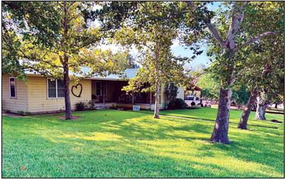 Congratulations to the winner of Yard of the Month for September, Jr. &amp; Vicki Moreno of Richland Springs. They will receive a gift card to The Feedlot from our sponsor, McKinnerney Real Estate. This has been a challenging summer to say the least, and their yard still looks beautiful. Photo by Michelle McKinnerney