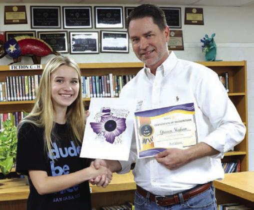 Marcus Wood recognizes Gracen Shahan as the winner of the T-Shirt Design