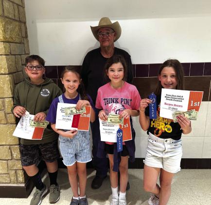 Here are the winners of the 4th grade winners of the San Saba Soil and Water Conservation District Annual Essay and Poster Contest. The Contest theme: “May the forest be with you, always!” Pictured (L-R): Wyatt Ward (3rd place poster), Molly Mays (2nd place poster), Emma Whitley (1st place poster), Harper Brown (1st place essay). Back row: Pat Pool (San Saba SWCD Board Member). Not pictured: Kallie Bush (4th grade teacher). Courtesy of Kallie Bush, 4th grade teacher, SSES