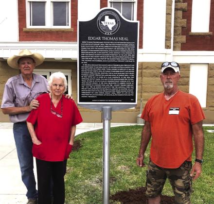 Standing with the new Texas Historical Marker on the east lawn of the Courhouse is (l-r): Ross J. Cox, Sr., Flora T. Vasquez, and Stephen C. Brister. Photograph by Christopher B. Ridgway
