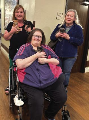 Regina Baker (left) and Kim Wells (right) of San Saba County Friends of Animals braved the rain on Thursday to take four kittens to visit the San Saba Nursing Home Residents. Pictured here with Mrs. Baker and Mrs. Wells is resident Renee Spurgeon. The Residents were able to hold and pet the kittens and really seemed to enjoy their time with them. For more information on the kittens that are available for adoption, visit sansabaanimals.com. Photo courtesy of Regina Baker