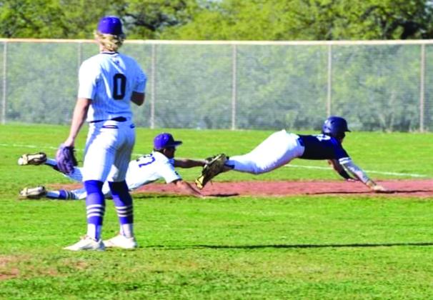 Winton Lackey dives to get the out.