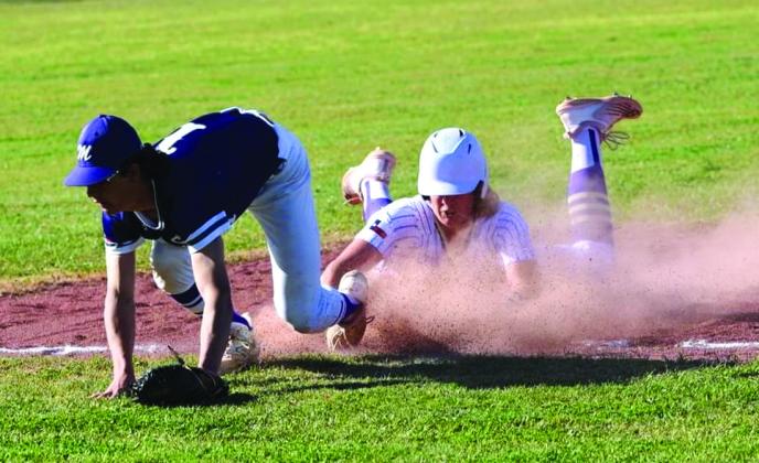 Safe!! Layke Haynes sliding head first into 3rd base.