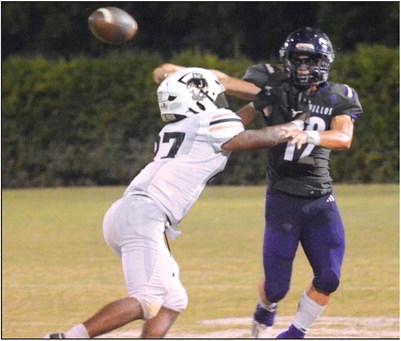 Courtesy of Rita Boultinghouse Winton Lackey (12) gets a pass off before the Eagle defense can stop him.