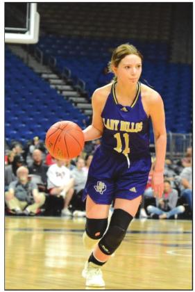 San Saba High School girls varsity basketball sophomore guard Jenna Lambert (11) dribbles the ball upcourt on Friday, March 4, 2022, during the Lady Dillos' 2A state semifinal game vs. Gruver High School at the Alamodome in San Antonio. (Photo by Rita Boultinghouse)