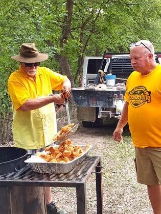Darrin Barker and Greg McGregor were having fun as they fried up lots of fish for the Fish Fry last Sunday night at Risien Park sponsored by San Saba's First Baptist Church. ––Staff Photo