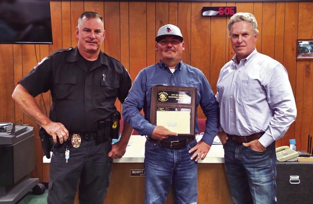 Jason Vogel, Animal Control Director for San Saba is seen here proudly holding his “Supervisor of the Second Quarter” award for 2024. Investigator Steven Newkirk (on Jason's right) and Alderman Marcus Amthor took part in the presentation. Jason was also given a gift certificate to a local restaurant.