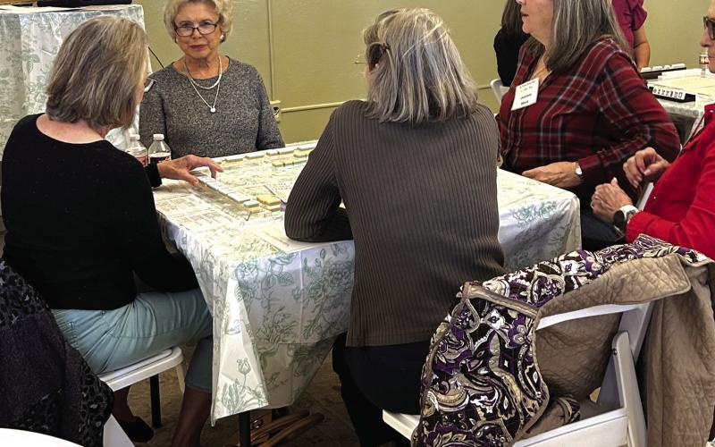 The ladies are having a fun time learning this new game. Courtesy of Donna Baxter