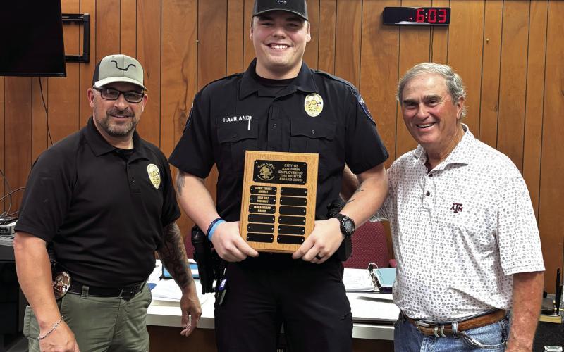 Lane Haviland, Police Officer San Saba Police Department, was selected as the Employee of the Month for March. Chief Stephen Lozano (left) and Alderman Robert Whitten (right) presented Lane with a plaque with his name on it and a gift certificate to a local restaurant at the March City Council meeting held on March 10, 2026.