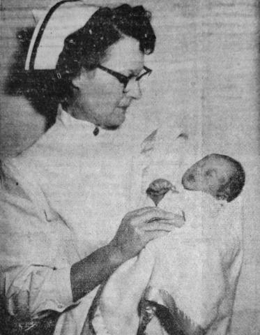 HO HUM...CAN’TCHALETAFELLER SLEEP?––Young William Thomas seems to have made a New Year’s resolution to get lots of sleep in 1955. Son of Mr. and Mrs. W. L. Cooley of San Saba, he was born Jan. 4, the first baby of the new year born in San Saba Memorial Hospital. Holding him for the cameraman is Mrs. Pearl Long, supervisor of nurses at the hospital.