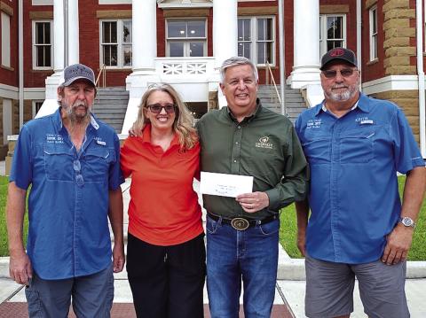 From L-R: Larry Davis (Cow Camp), Janis and Shawn Hull (Cherokee Home for Children), and Keith Hebert (Cow Camp)