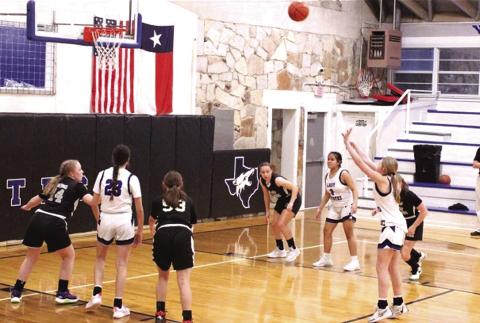 RSJH Lady Coyotes #23 Macy Mask and #2 Ayleen Aviles are seen here with #15 Kaylee Salas who is looking to score two more for her team as they run away from their competition. Courtesy of Richland Springs Coyote Booster Club