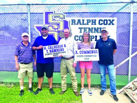 Left to right-Ralph Cox, Michael Calderon, Tyler Hawkins, Alicia Cummings and David Bourke holding banners from the Alumni Tennis Tournament.
