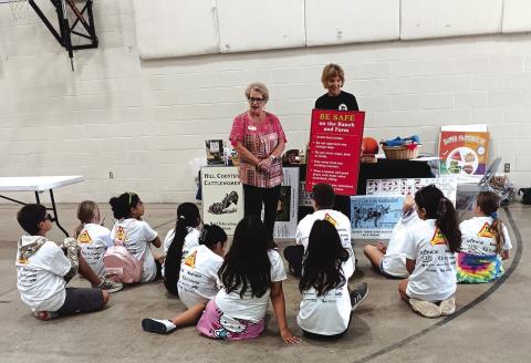 The woman on the left speaking to the fifth graders is Jill Pilcher, VP for Beef Education. The woman on the right holding the sign is Betsy Rafferty.