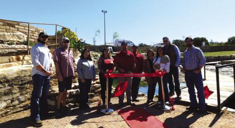 Left to right: from the Chamber of Commerce - Devin Hoyt, Larry Davis, and Mia Stewardson; from On Point - Cutter McClain, Aubrey Burkett, Nikki Rogers, Dakota Harding, Nick Hoppe and his wife Janie; and Bill Baker (COC).