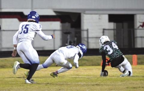 Joel Valdez going in for the tackle with Joey Bond right behind last week in the win against the Blackwell Hornets. Photo by Rita Boultinghouse