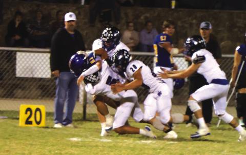 Gotcha! Coyotes EJ Aviles (#5)and Gage Behrens (#20) making the tackle in last Friday’s win over Rochelle.