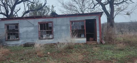 Damage to metal building - By Kerinda Stewart Chaudoin-Turner