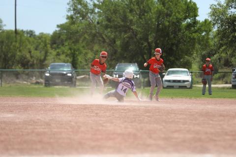#14 Landon Baskin slides safe into second base