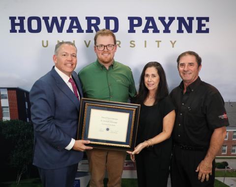 Dr. Chris Rosborough was named the recipient of HPU’s Outstanding Faculty Member Award. Pictured from left to right are Dr. Cory Hines, HPU president; Dr. Chris Rosborough; and Lisa Underwood and Leo Underwood, representing Underwood’s Cafeteria. 