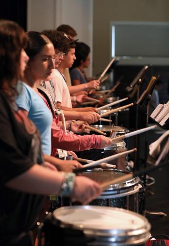 Students in HPU’s 51st Band Leadership Camp practice percussion in Mims Auditorium.